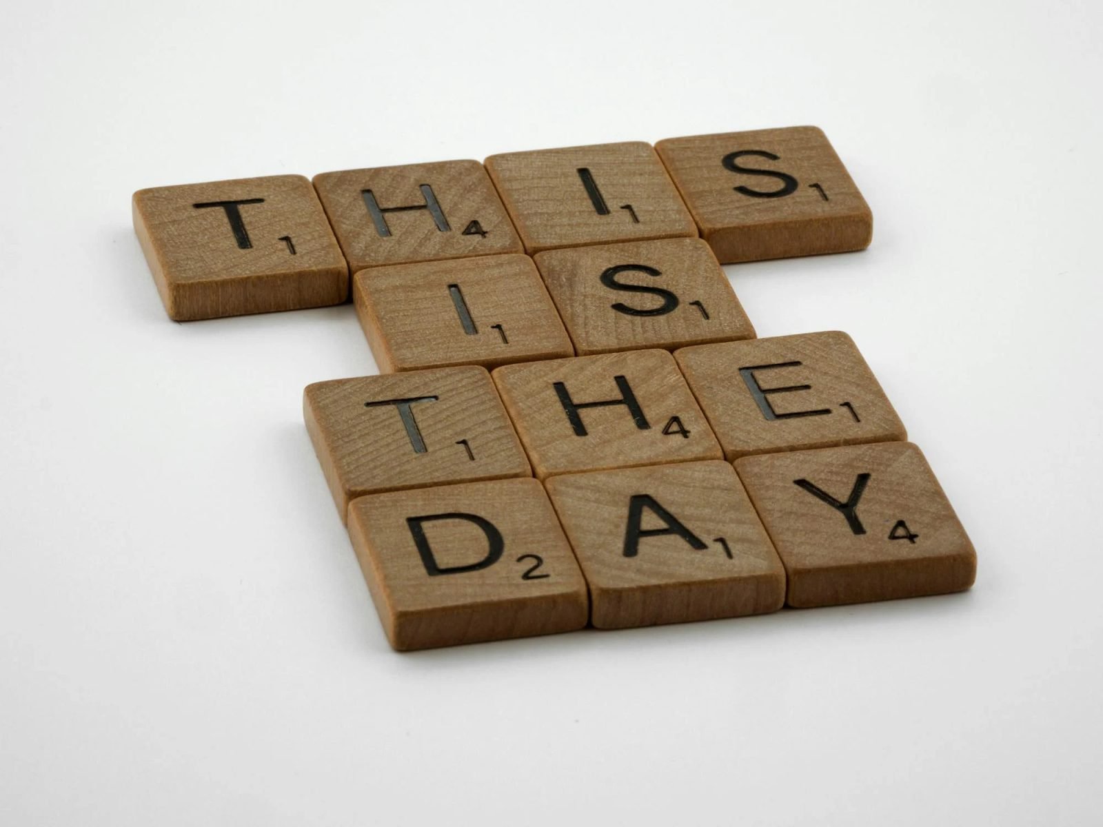 Scrabble tiles that say this is the day.