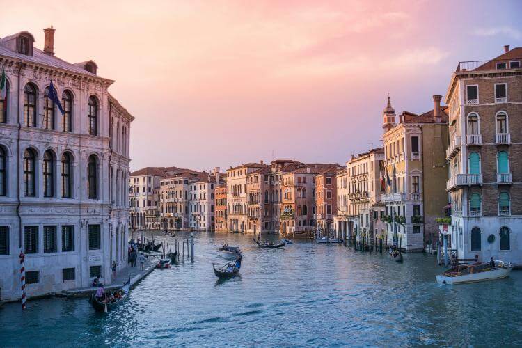 Picture of a venice canal at sunrise or sunset.