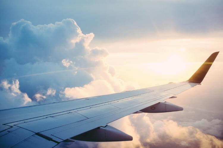 Window view of airplane wing while in flight.